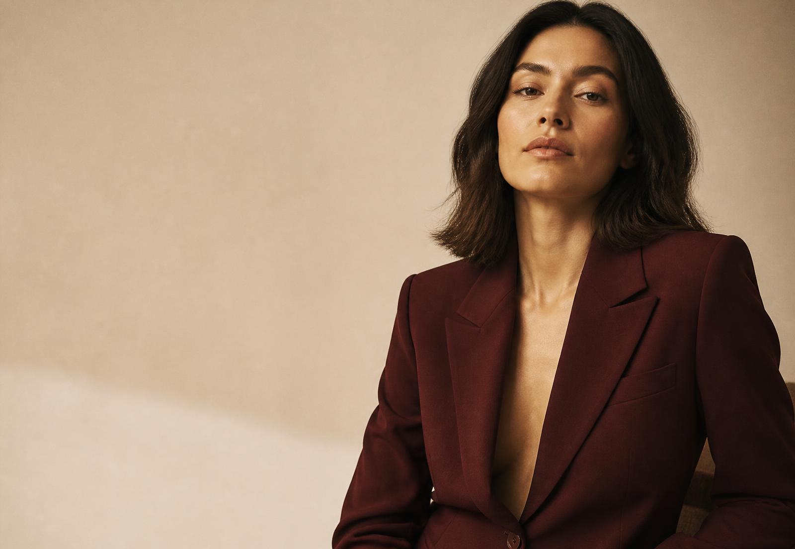 Creative director in an oxblood blazer photographed for a brand campaign